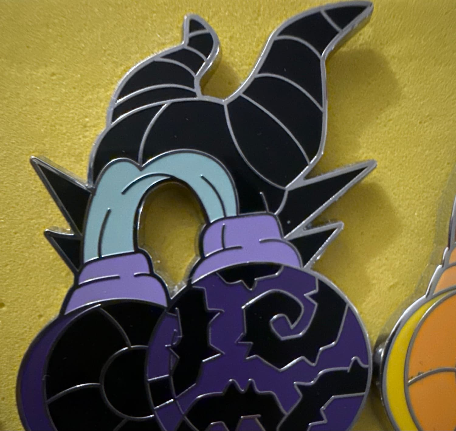 Maleficent Head with Stylized Purple Orbs Pin front