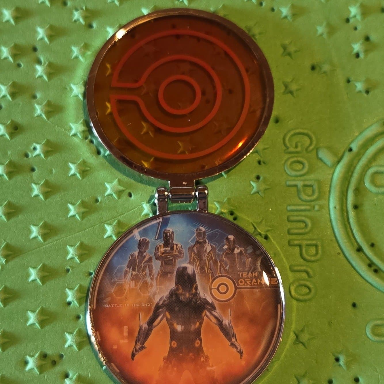 TRON Lightcycle Run Team Emblems Orange Hinged Pin front