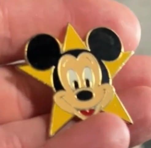Mickey Mouse Head in Front of a Big Yellow Star