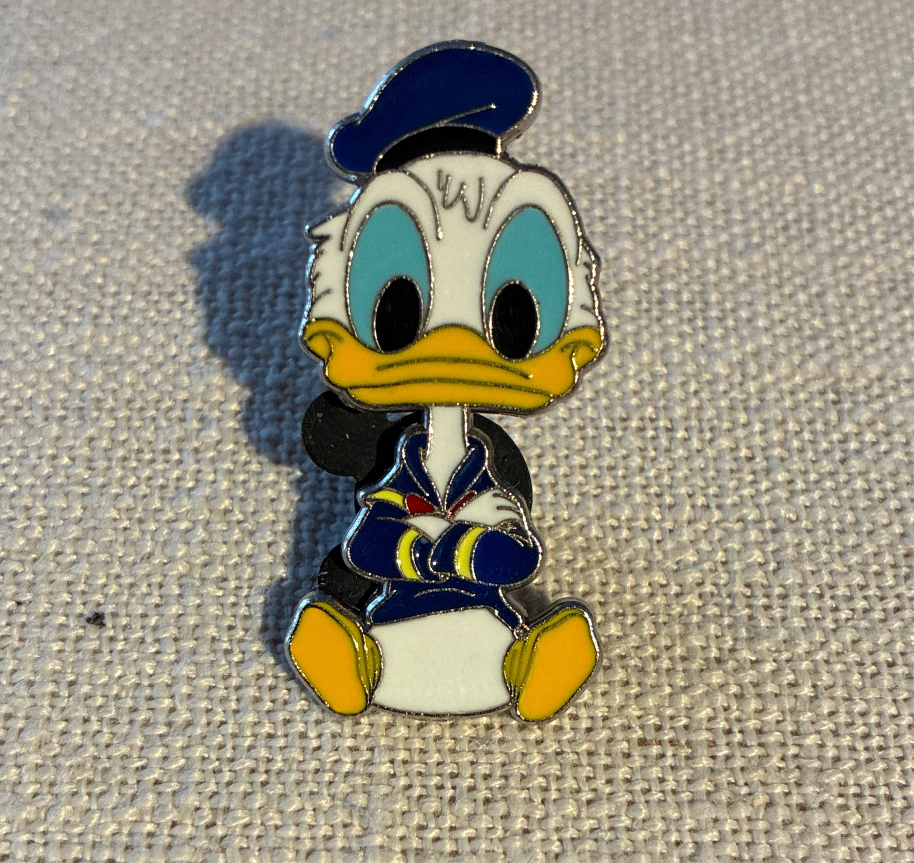 Donald Duck Chibi Sitting Arms Crossed Pin front