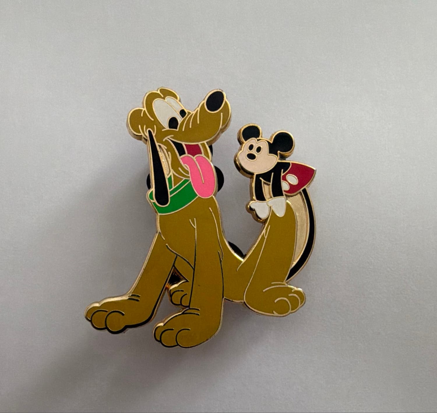 Mickey riding Pluto rocking horse front