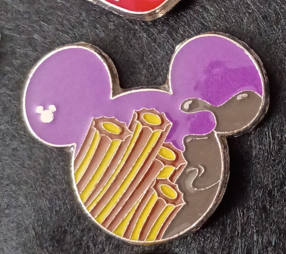 Mickey Mouse icon head, with churros and chocolate sauce