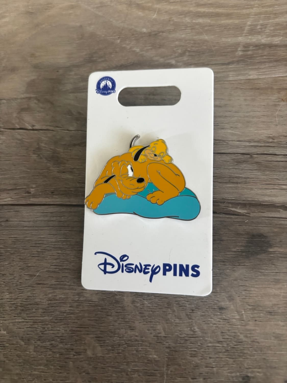Pluto with Sleeping baby Pluto