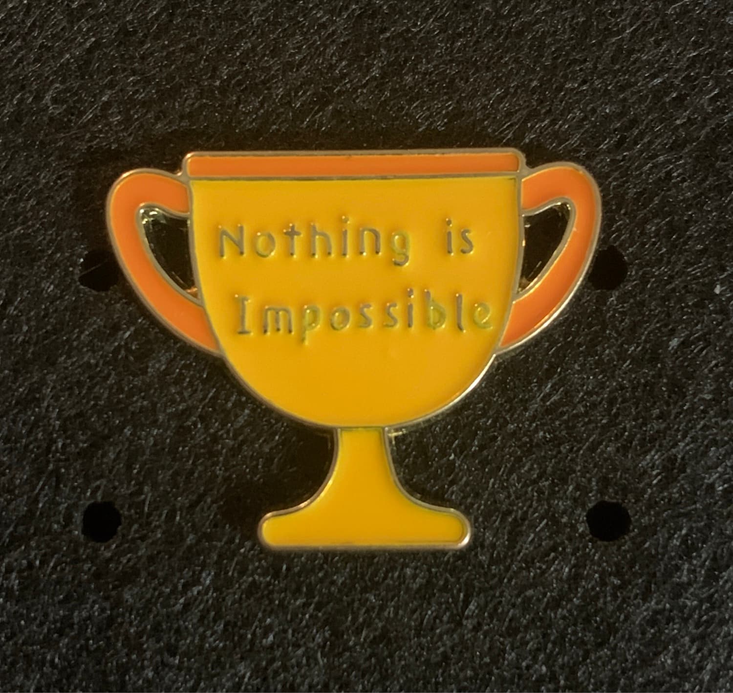 Inspirational Trophy Pin with "Nothing is Impossible" text
