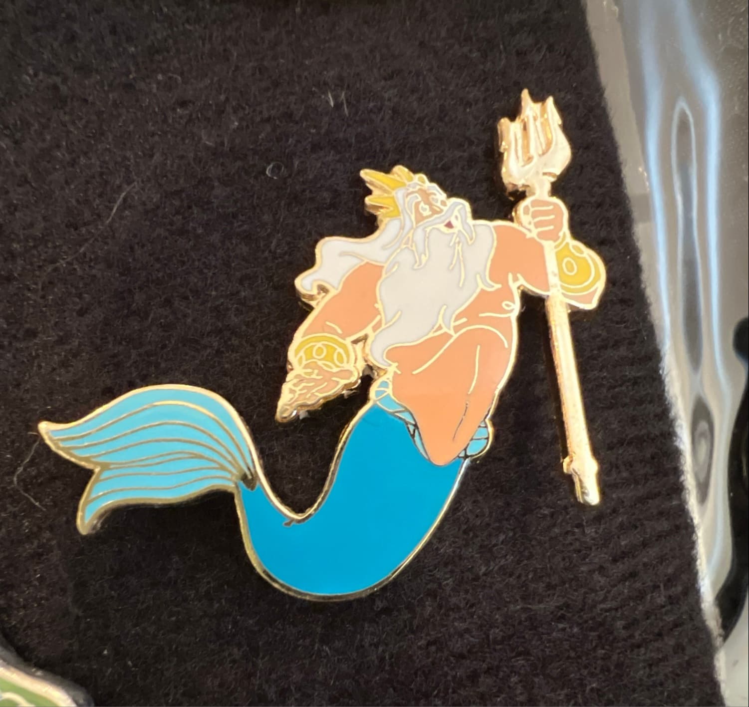 King Triton Holding Up His Trident