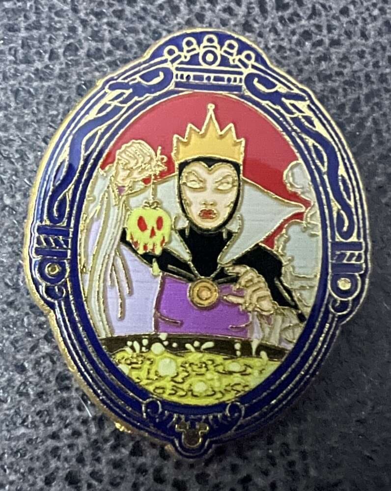 The Evil Queen Holding the Poison Apple in the Magic Mirror