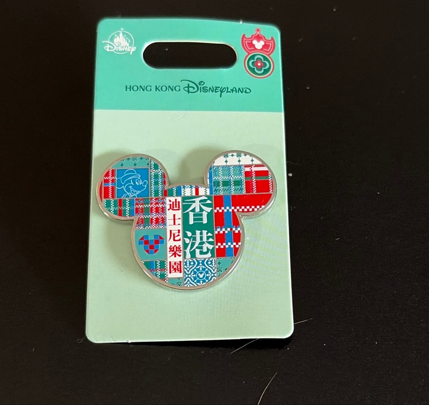Mickey Head Icon with Plaid Pattern and Hong Kong Disneyland Chinese Text