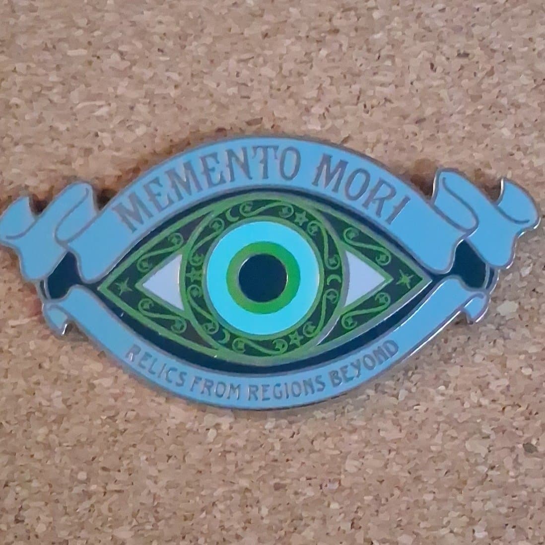 Haunted Mansion Memento Mori Eye Logo Relics From Regions Beyond Pin front