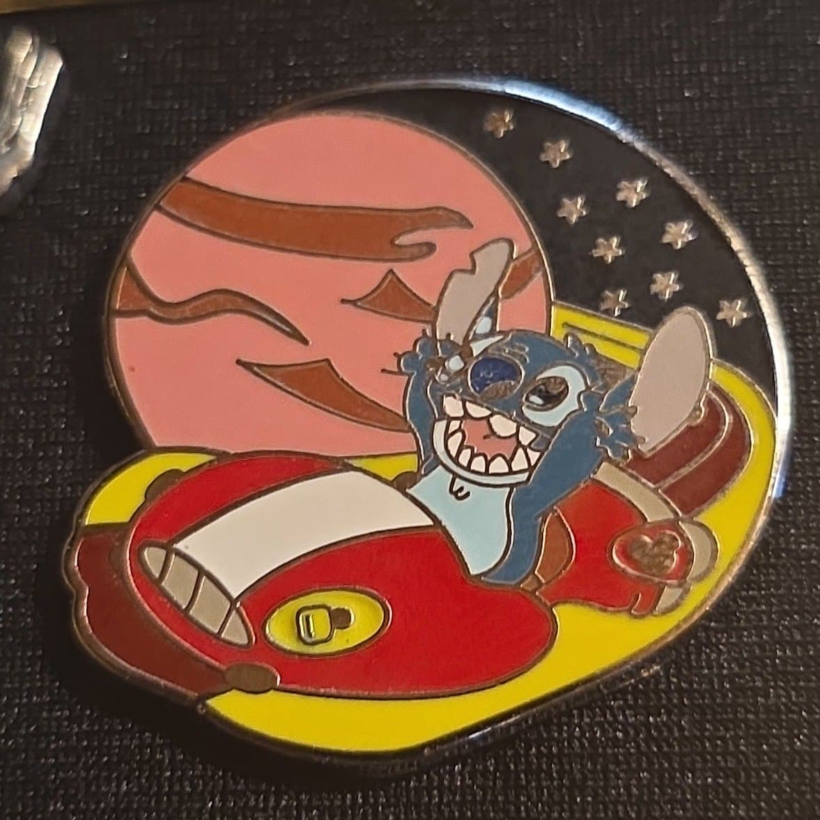 Stitch in his red hover car front