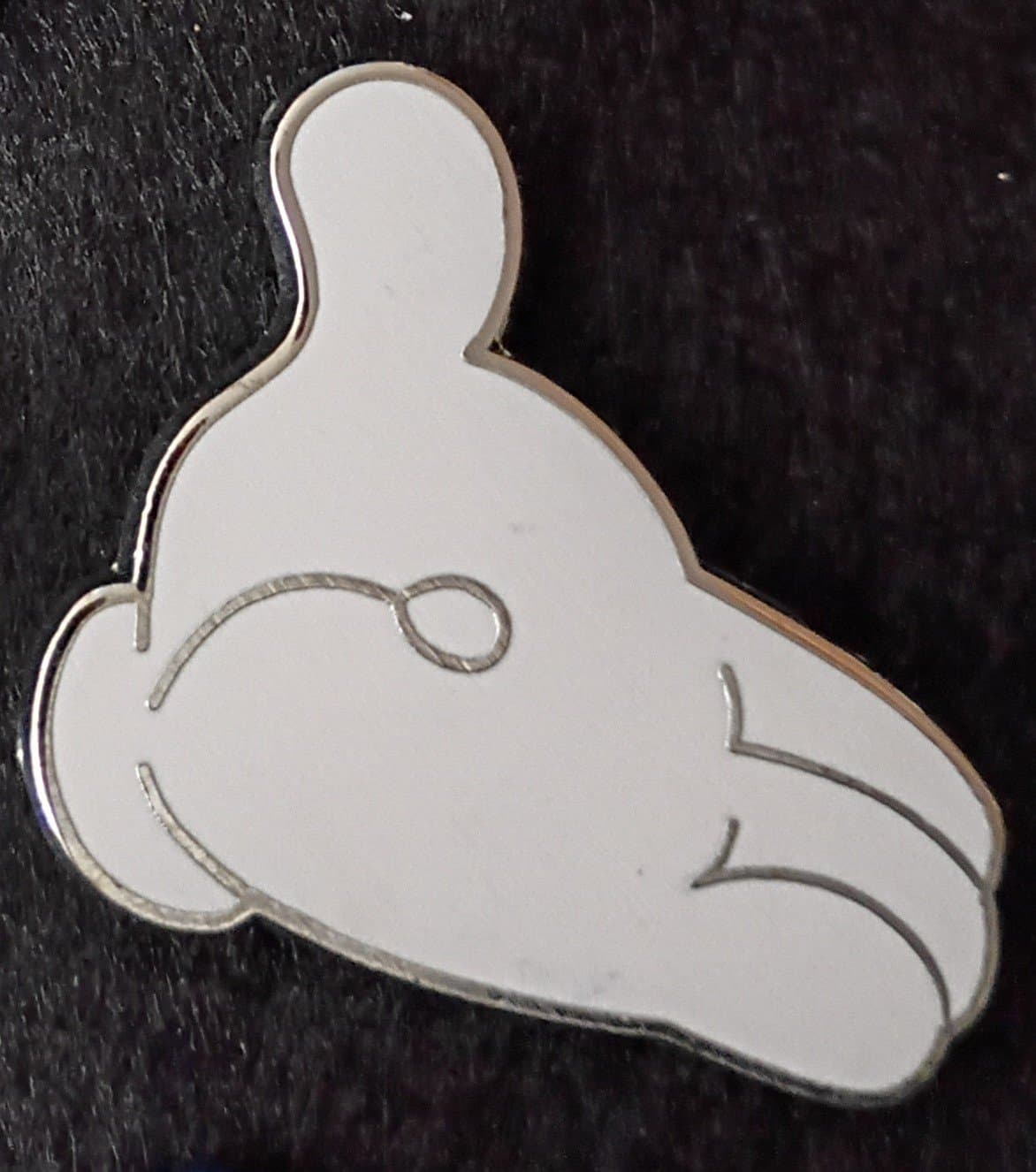 Mickey Mouse's white glove hand front