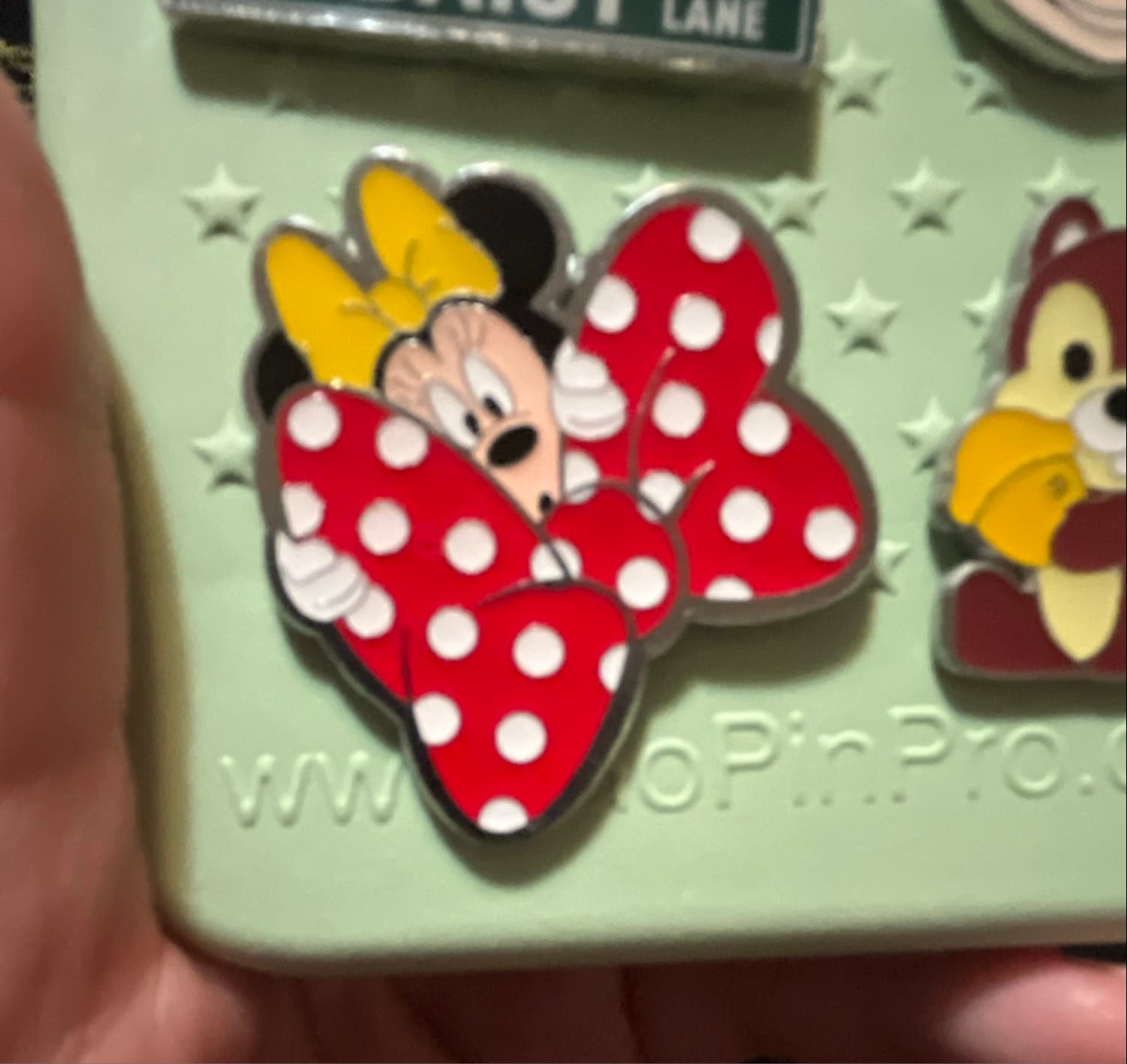 Minnie Mouse Peeking from Behind a Red Polka-Dot Bow by MII