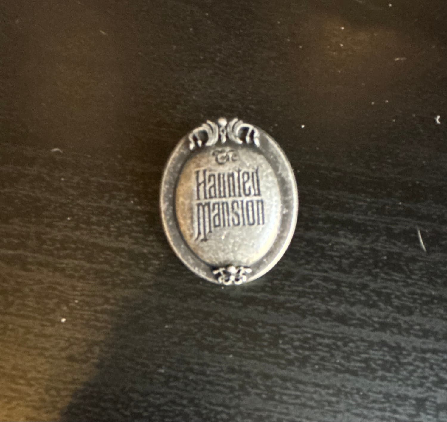 The Haunted Mansion Logo Pin front