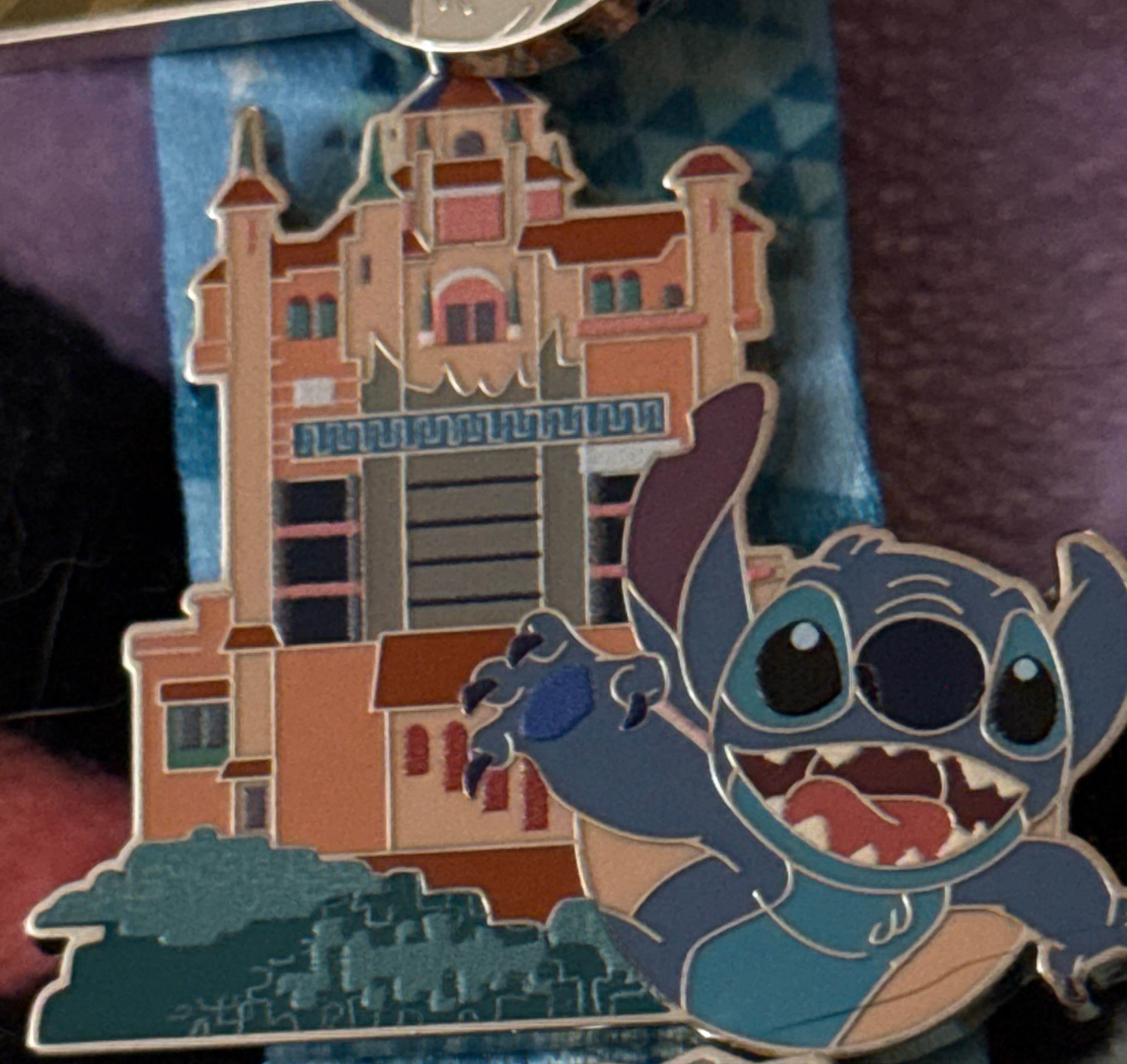 Stitch in front of Tower of Terror - 2025 Disney World Icons Pin Trading Starter Set front