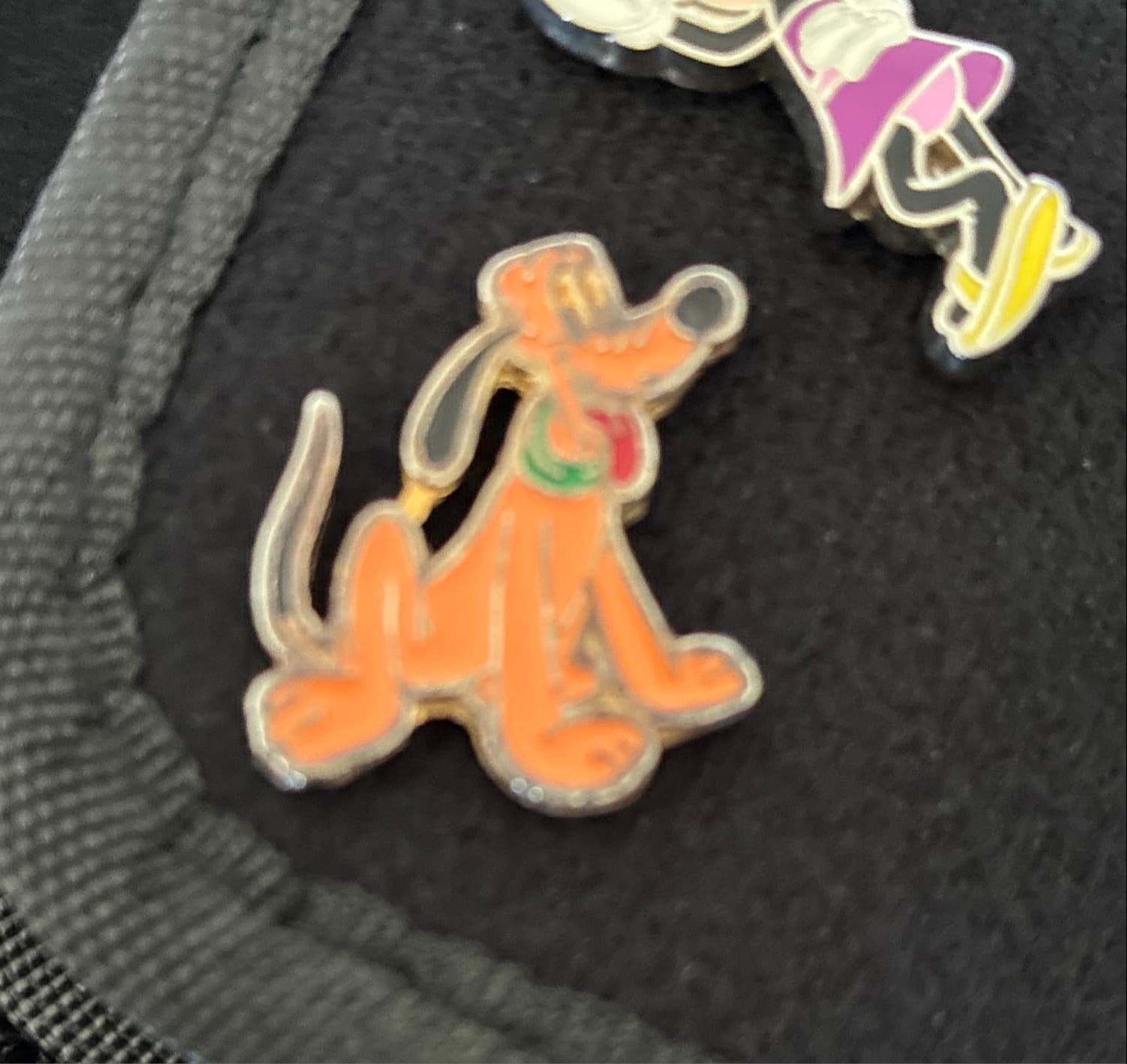 Pluto Sitting with his Tongue Out