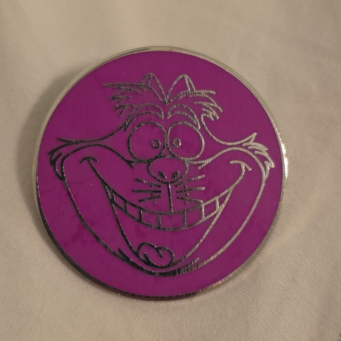 Cheshire Cat Outline in Pink Circle front