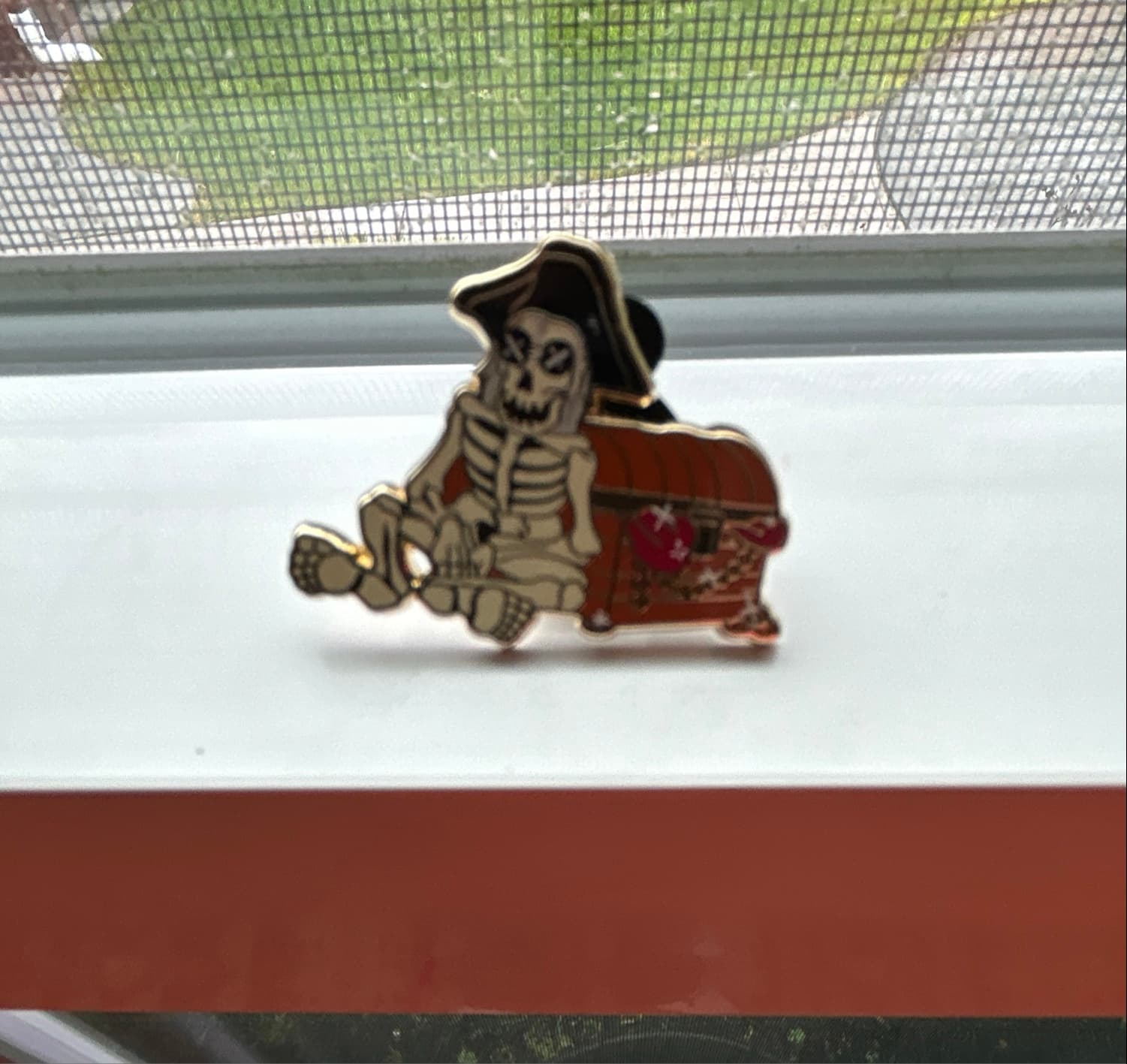 Pirate Skeleton Sitting on Gold Chest front
