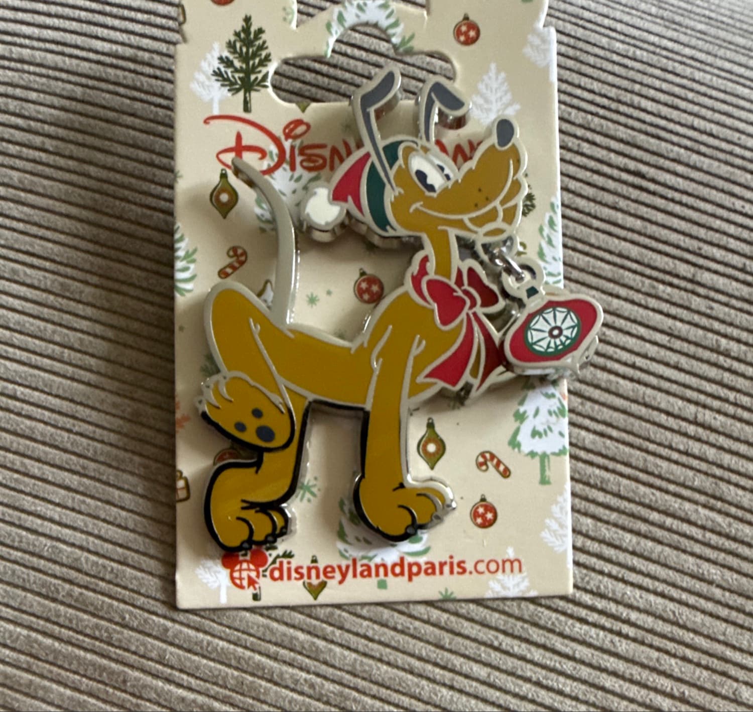 Pluto with Christmas Ornament and Red Bow front