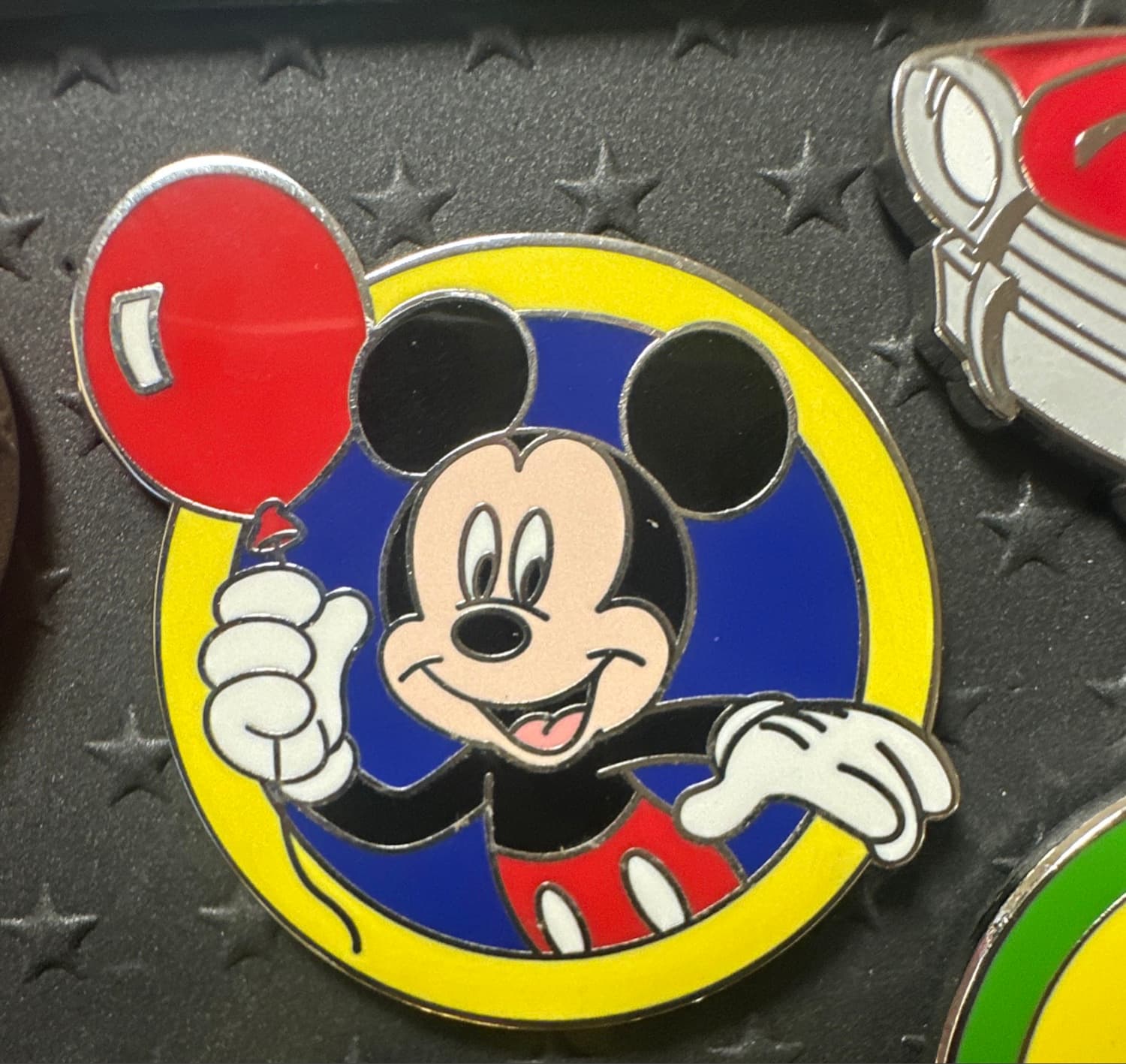 Mickey Mouse Holding Red Balloon in Blue and Yellow Circle